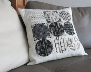 Luna Lovequilts - A black and neutral cushion / pillow - Hand applique circles and grid machine quilting
