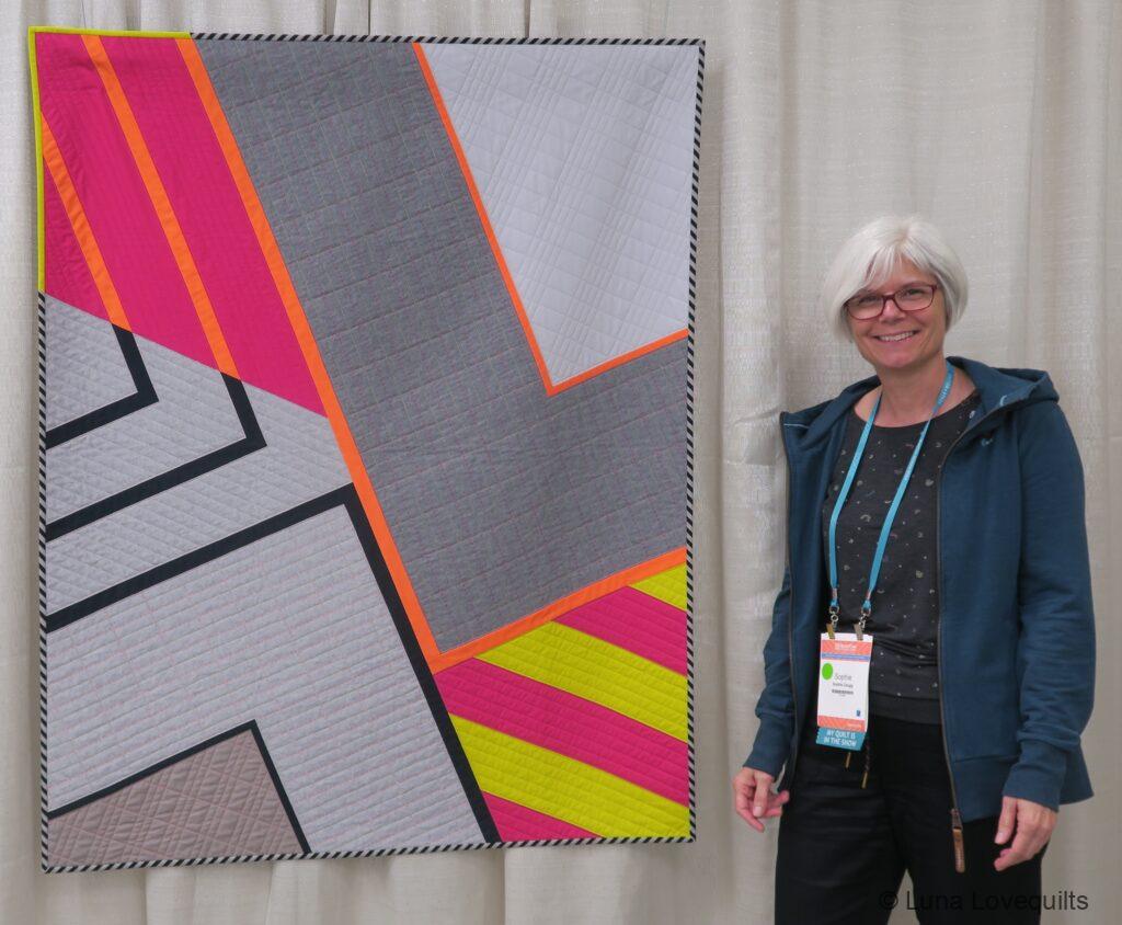 My quilt Impact hanging at Quiltcon 2023